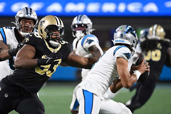 Carolina Panthers quarterback Bryce Young (9) is pressured by New Orleans Saints defensive tackle Nathan Shepherd (93). Mandatory Credit: Bob Donnan-USA TODAY Sports